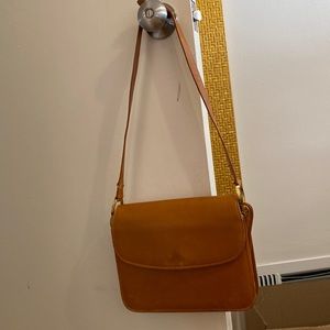 Gucci (vintage) leather purse. Small tear on the strap.